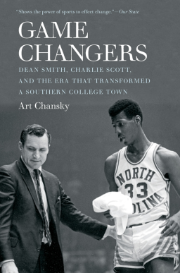 A black and white photograph of a coach and a basketball player.